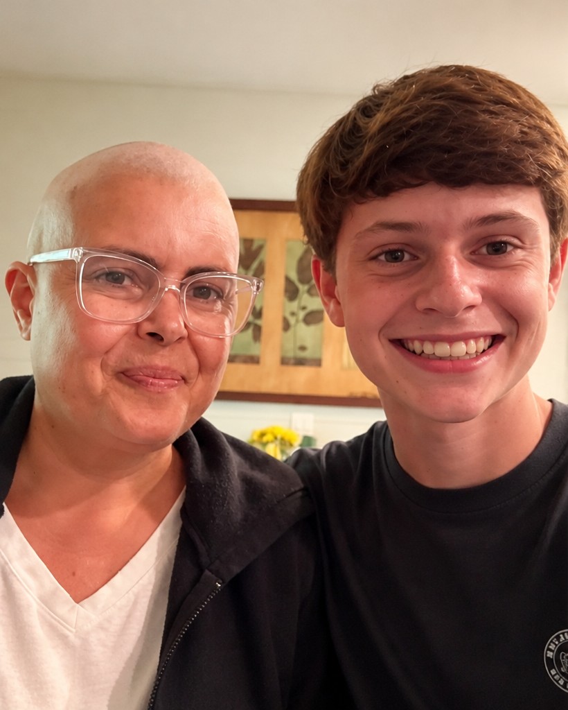 Angie smiling with her son